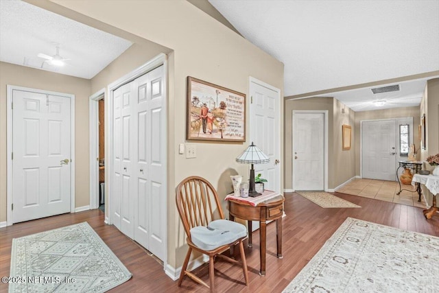 1275 Pirates Cove Ln, Fleming Island, FL 32003 - entrance foyer with baseboards, wood finished floors, and a ceiling fan