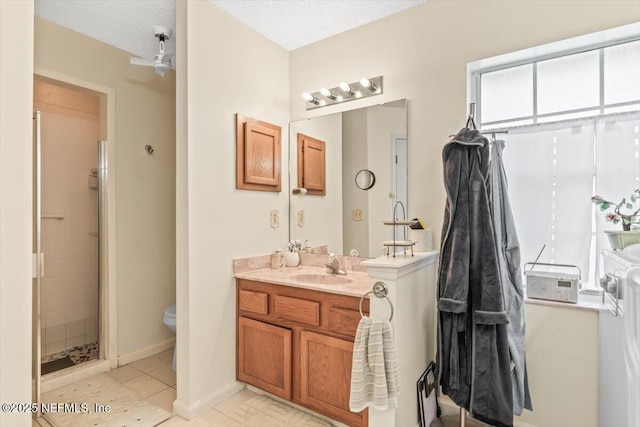 1275 Pirates Cove Ln, Fleming Island, FL 32003 - bathroom with vanity, toilet, tiled shower, and baseboards