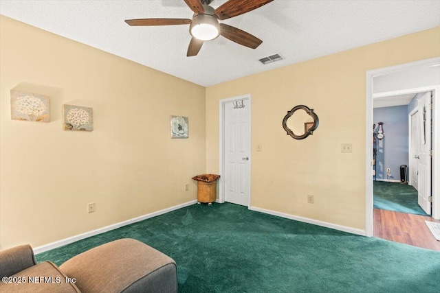 1275 Pirates Cove Ln, Fleming Island, FL 32003 - bedroom with carpet, baseboards, a ceiling fan, and a textured ceiling