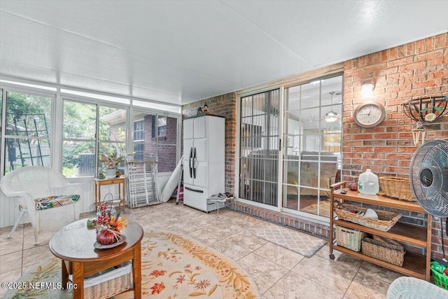 1275 Pirates Cove Ln, Fleming Island, FL 32003 - sunroom featuring brick wall