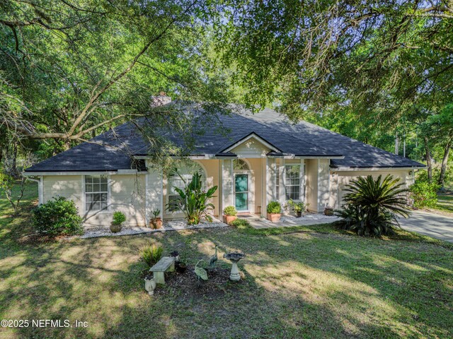 96428 Chester Rd, Yulee, FL 32097 - view of front of property with a front lawn and roof with shingles
