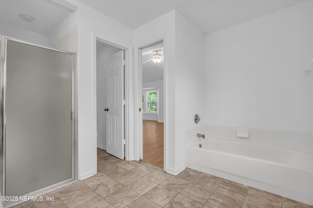 96428 Chester Rd, Yulee, FL 32097 - full bath featuring a shower stall, a bath, and baseboards