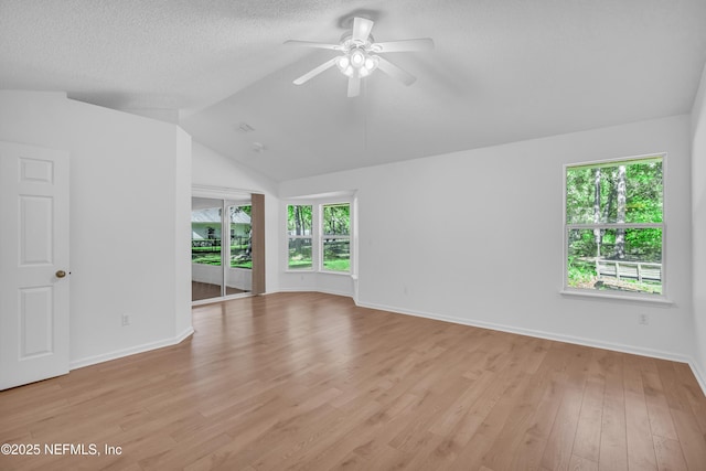 96428 Chester Rd, Yulee, FL 32097 - unfurnished room featuring a ceiling fan, healthy amount of natural light, light wood finished floors, lofted ceiling, and baseboards