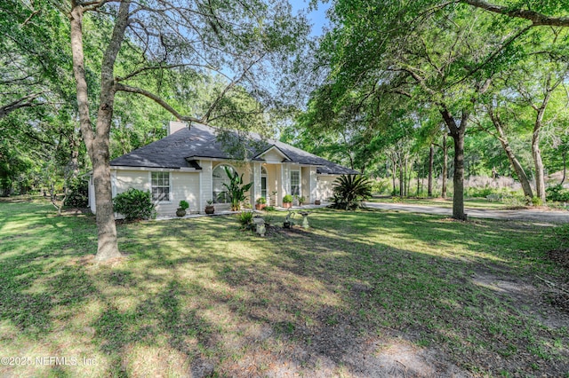 96428 Chester Rd, Yulee, FL 32097 - ranch-style house with a front yard and a shingled roof