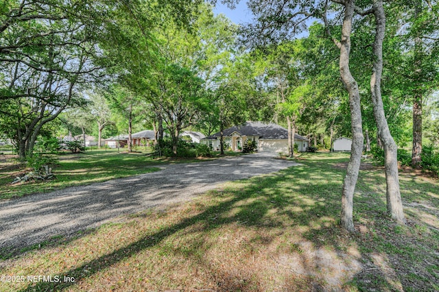 96428 Chester Rd, Yulee, FL 32097 - view of front of home featuring driveway and a front yard