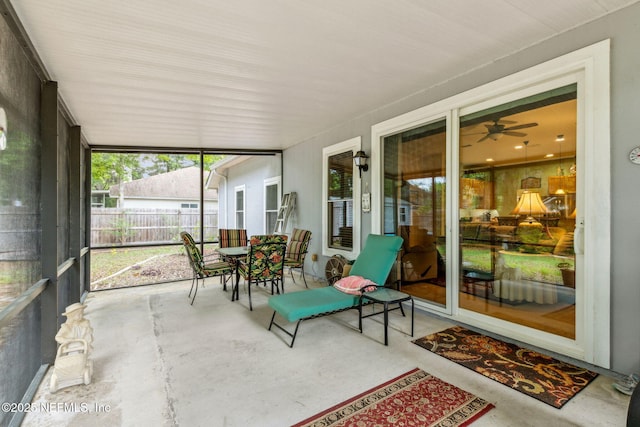 sunroom with a ceiling fan