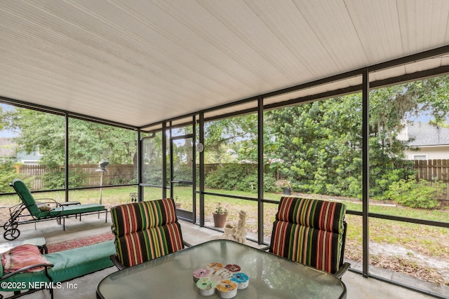 sunroom with outdoor dining space and plenty of natural light
