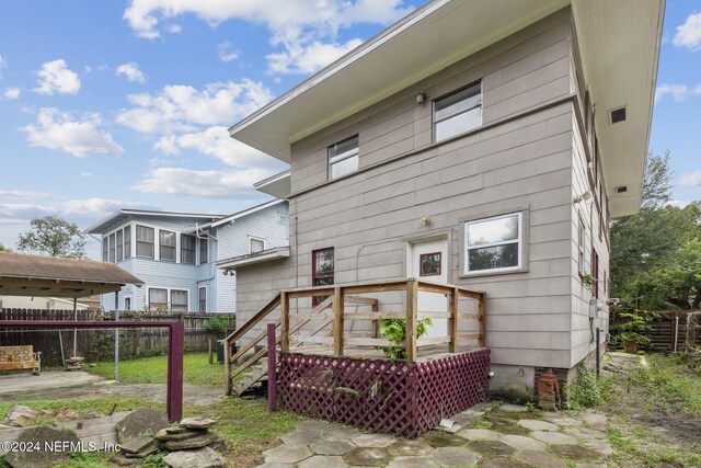 2143 Myra St, Jacksonville, FL 32204 - back of house featuring fence and a wooden deck