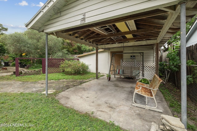 2143 Myra St, Jacksonville, FL 32204 - view of patio with fence and a carport