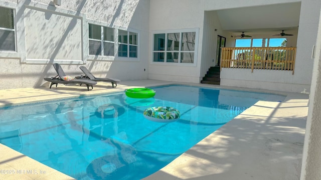5491 River Trail Rd N, Jacksonville, FL 32277 - swimming pool with a ceiling fan and a patio area