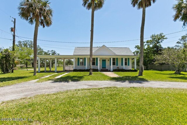 3060 Lewis Speedway, Saint Augustine, FL 32084 - view of front of property featuring covered porch, driveway, and a carport