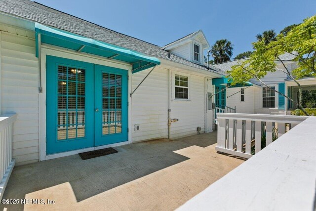 3060 Lewis Speedway, Saint Augustine, FL 32084 - doorway to property with french doors and roof with shingles