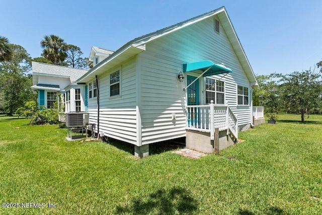 3060 Lewis Speedway, Saint Augustine, FL 32084 - view of home's exterior with cooling unit and a yard