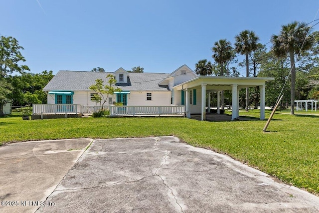 3060 Lewis Speedway, Saint Augustine, FL 32084 - rear view of house with a lawn and a deck
