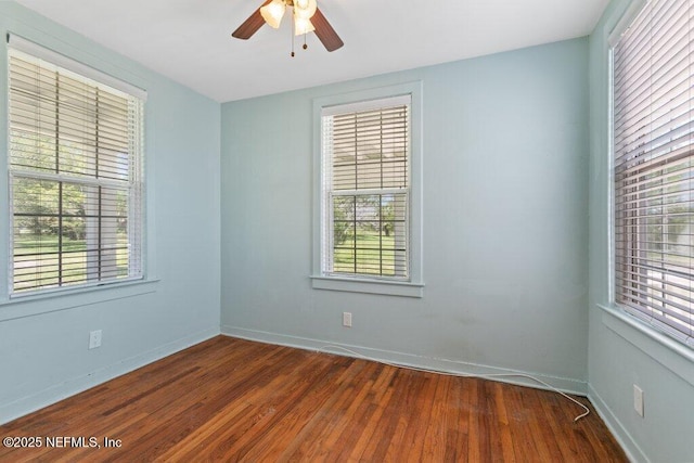 3060 Lewis Speedway, Saint Augustine, FL 32084 - spare room with dark wood-style flooring, a ceiling fan, and baseboards