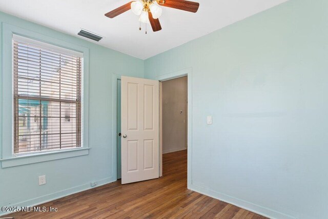 3060 Lewis Speedway, Saint Augustine, FL 32084 - spare room featuring baseboards, wood finished floors, and a ceiling fan