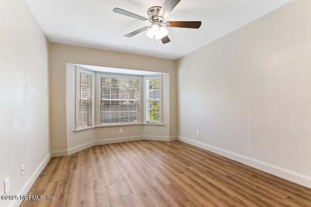 3060 Lewis Speedway, Saint Augustine, FL 32084 - empty room featuring wood finished floors, a ceiling fan, and baseboards