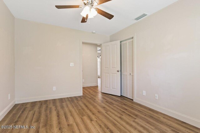 3060 Lewis Speedway, Saint Augustine, FL 32084 - spare room with wood finished floors, a ceiling fan, and baseboards