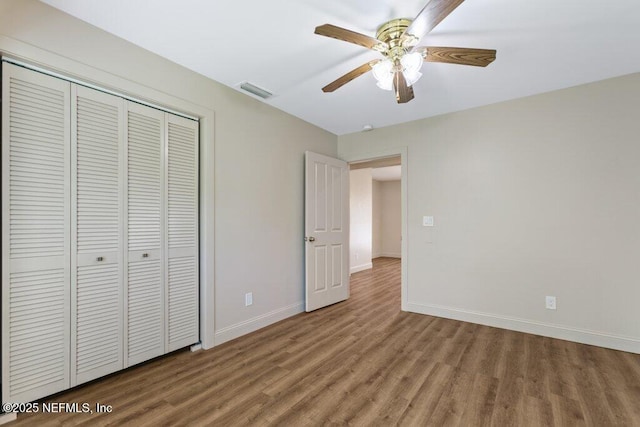 3060 Lewis Speedway, Saint Augustine, FL 32084 - unfurnished bedroom with wood finished floors, a closet, baseboards, and ceiling fan