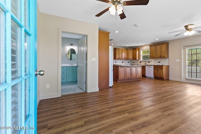 3060 Lewis Speedway, Saint Augustine, FL 32084 - kitchen featuring white dishwasher, a ceiling fan, brown cabinetry, baseboards, and light countertops