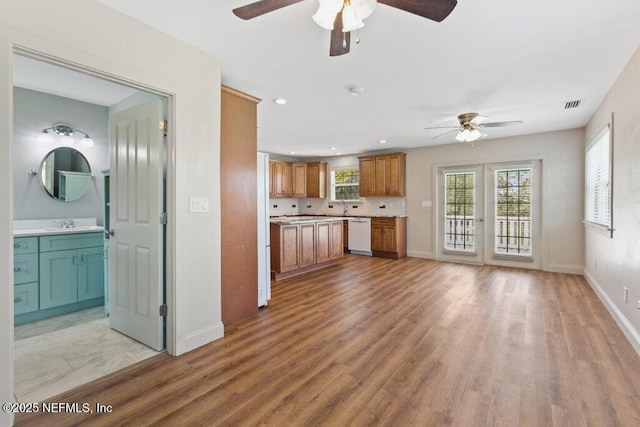3060 Lewis Speedway, Saint Augustine, FL 32084 - kitchen featuring white dishwasher, ceiling fan, light wood finished floors, light countertops, and recessed lighting