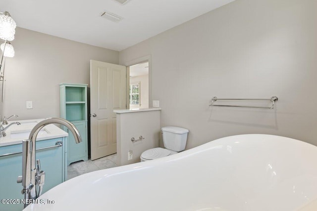 3060 Lewis Speedway, Saint Augustine, FL 32084 - bathroom with a soaking tub, vanity, and toilet