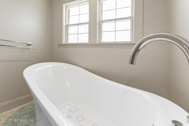 3060 Lewis Speedway, Saint Augustine, FL 32084 - bathroom with a freestanding bath and baseboards