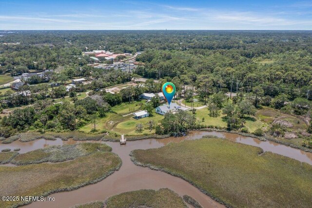 3060 Lewis Speedway, Saint Augustine, FL 32084 - aerial view of property and surrounding area with a heavily wooded area and a large body of water