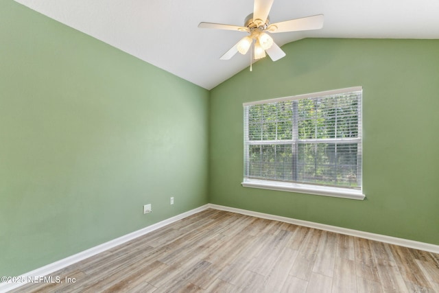 7990 Baymeadows Rd Unit 2404, Jacksonville, FL 32256 - spare room featuring wood finished floors, ceiling fan, vaulted ceiling, and baseboards