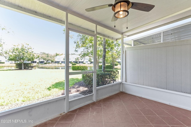 7990 Baymeadows Rd Unit 2404, Jacksonville, FL 32256 - unfurnished sunroom featuring a water view, a ceiling fan, and a residential view