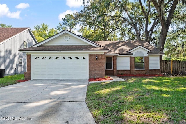 2767 Laten Ln, Jacksonville, FL 32216 - ranch-style house featuring brick siding, driveway, a garage, and roof with shingles