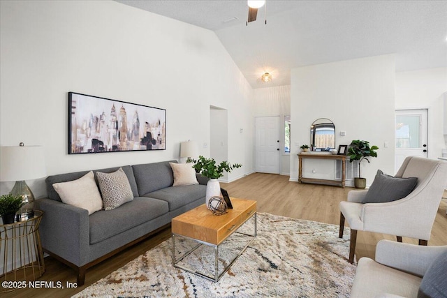 2767 Laten Ln, Jacksonville, FL 32216 - living room with wood finished floors, high vaulted ceiling, and ceiling fan