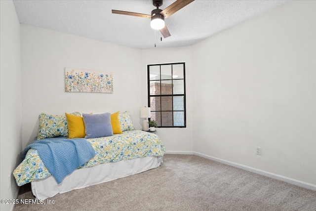 2767 Laten Ln, Jacksonville, FL 32216 - carpeted bedroom with baseboards, a textured ceiling, and ceiling fan