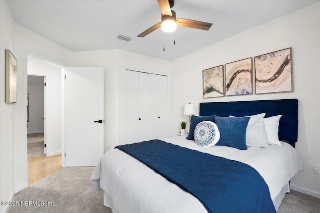 2767 Laten Ln, Jacksonville, FL 32216 - carpeted bedroom with a closet, ceiling fan, and baseboards