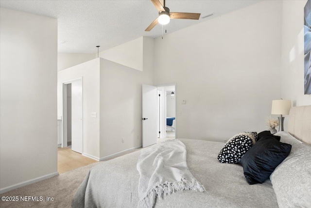 2767 Laten Ln, Jacksonville, FL 32216 - carpeted bedroom featuring vaulted ceiling, baseboards, and a ceiling fan