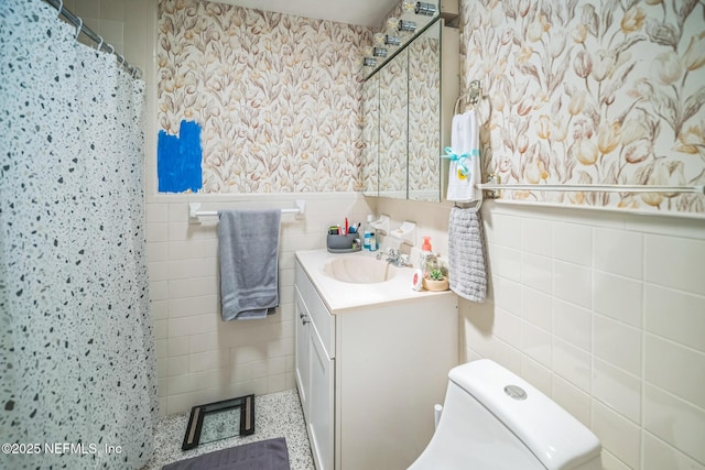 723 Montego Rd W, Jacksonville, FL 32216 - bathroom with tile walls, a wainscoted wall, vanity, toilet, and a shower with curtain