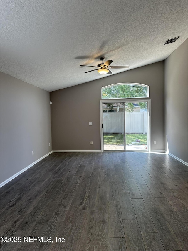 1456 Greenway Pl, Fleming Island, FL 32003 - empty room with dark wood-style flooring, a textured ceiling, ceiling fan, and baseboards