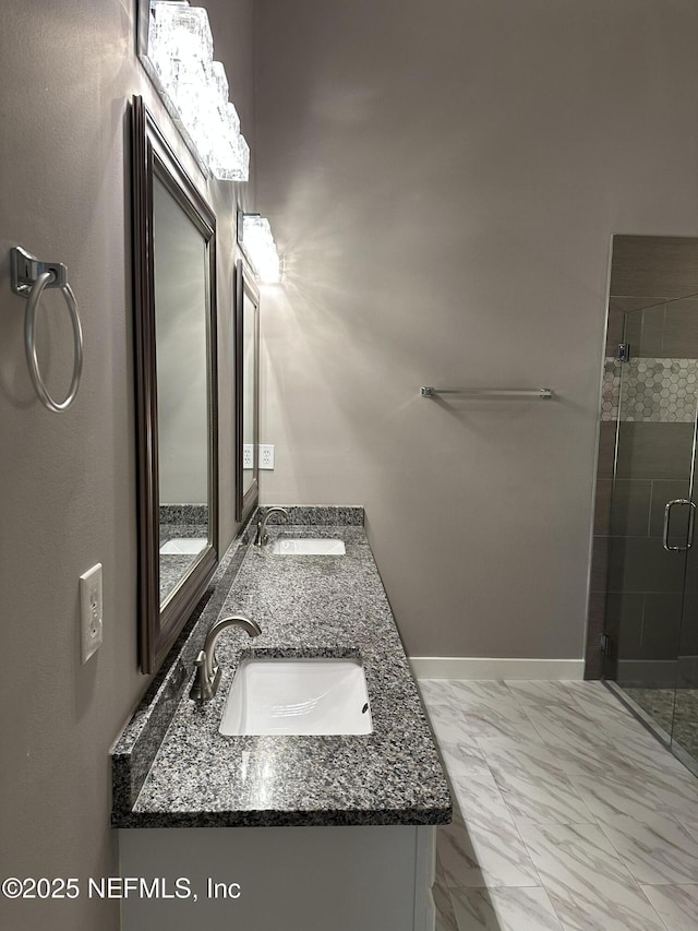 1456 Greenway Pl, Fleming Island, FL 32003 - bathroom featuring a shower stall, double vanity, marble look tile flooring, and baseboards