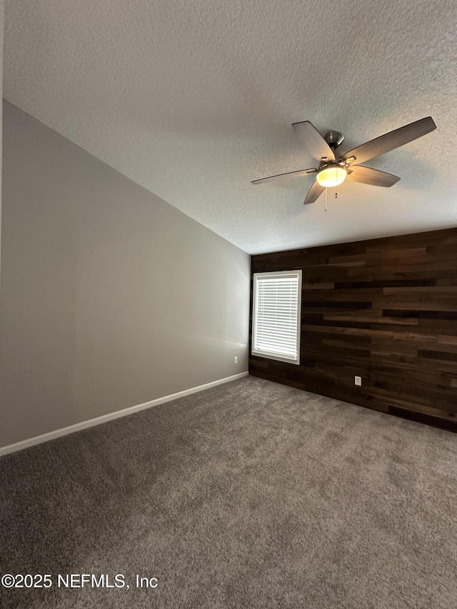 1456 Greenway Pl, Fleming Island, FL 32003 - carpeted empty room with a ceiling fan, a textured ceiling, and baseboards