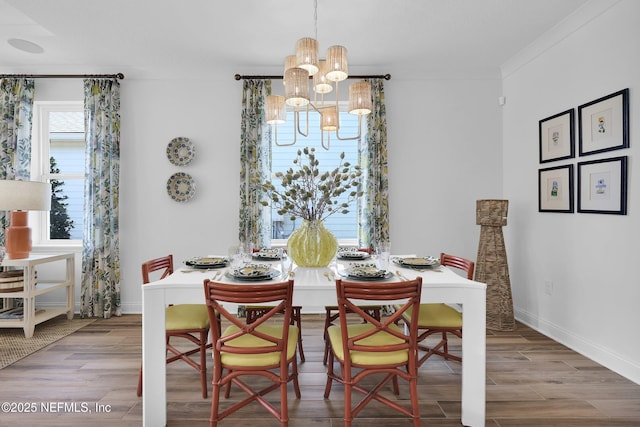 44 Sea Grn Way, Ponte Vedra, FL 32081 - dining area featuring a chandelier, wood finished floors, and baseboards