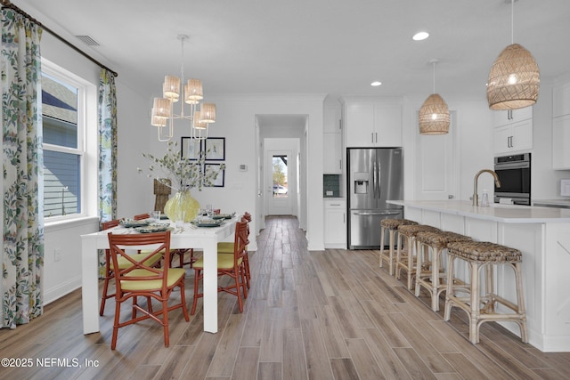 44 Sea Grn Way, Ponte Vedra, FL 32081 - dining room with a chandelier, light wood-style floors, plenty of natural light, and recessed lighting