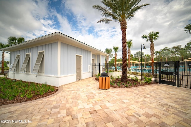 44 Sea Grn Way, Ponte Vedra, FL 32081 - view of patio with fence and a community pool