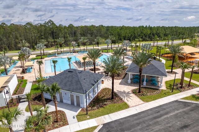 44 Sea Grn Way, Ponte Vedra, FL 32081 - drone / aerial view of a pool area and a forest