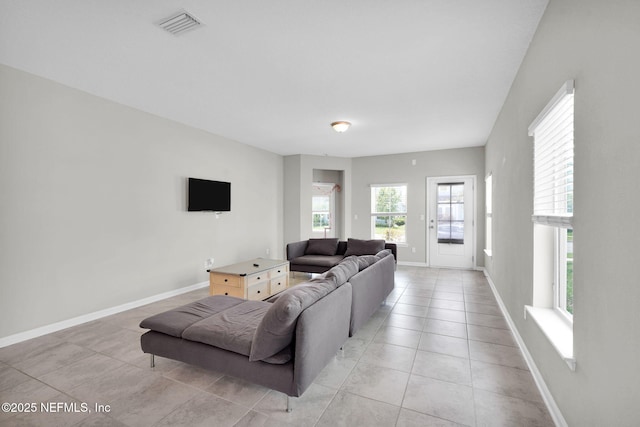 328 Clarys Run, Saint Augustine, FL 32092 - living room with light tile patterned floors and baseboards