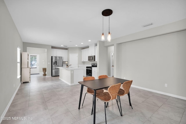 328 Clarys Run, Saint Augustine, FL 32092 - dining room featuring baseboards, light tile patterned floors, and recessed lighting