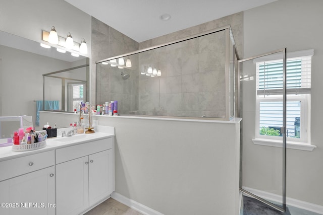 328 Clarys Run, Saint Augustine, FL 32092 - full bathroom featuring a tile shower, vanity, and baseboards
