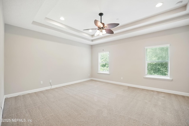 194 Magnolia Creek Walk, Ponte Vedra, FL 32081 - empty room featuring a tray ceiling, recessed lighting, a ceiling fan, baseboards, and light carpet