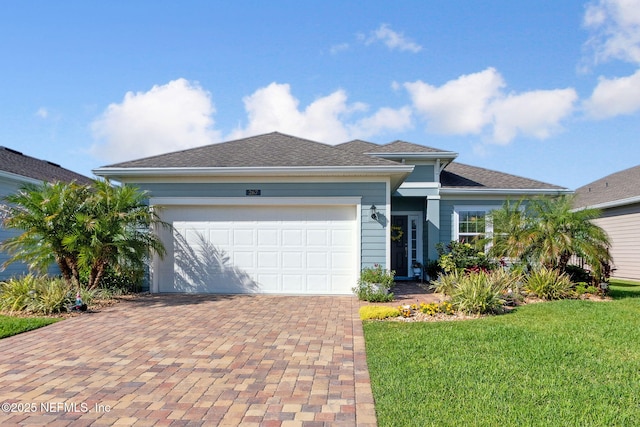 267 Ash Breeze Cv, Saint Augustine, FL 32095 - single story home with decorative driveway, a front yard, and a garage