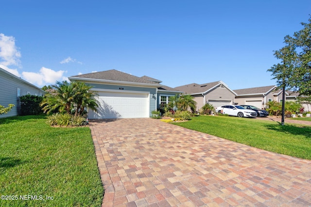 267 Ash Breeze Cv, Saint Augustine, FL 32095 - ranch-style house with an attached garage, a front lawn, and decorative driveway