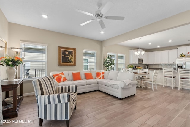267 Ash Breeze Cv, Saint Augustine, FL 32095 - living area featuring a chandelier, light wood-style floors, ceiling fan, and recessed lighting